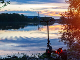 Modern powerful electric scooter on the beach at sunset © pavelkant