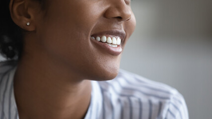 Close up happy millennial generation african multiracial woman with healthy toothy white smile...
