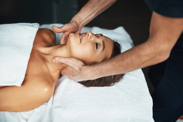 Obraz na płótnie Canvas Beautiful Caucasian woman receiving professional healing body treatment in spa salon