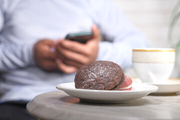 Close up of cookies and tea on table 