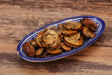 Roasted champignon with herbs and spices