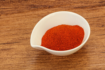Dry paprika powder in the bowl