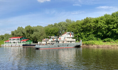 tug pusher river in the parking lot near the shore