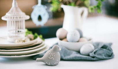 Easter background with eggs and spring branches. Happy Easter. Table setting. Holidays background.
