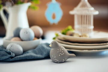 Easter background with eggs and spring branches. Happy Easter. Table setting. Holidays background.