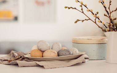 Easter background with eggs and spring branches. Happy Easter. Table setting. Holidays background.