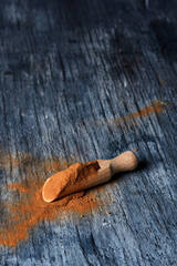 camu-camu powder in a wooden measuring scoop