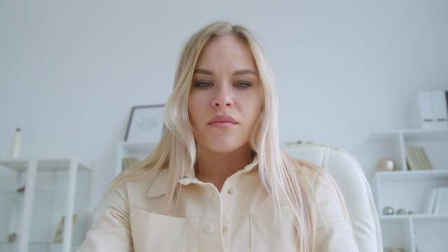 Expression young girl talking to camera making conference video call. Attractive woman closing laptop