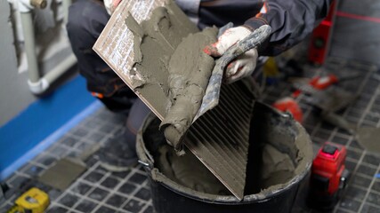 Tile work. House renovation - tiles on wall. Laying tiles on the wall.