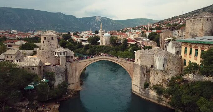 4K Footage Aerial View to the Old Bridge (Stari Most) in Mostar via the river Neretva, Bosnia and Herzegovina 