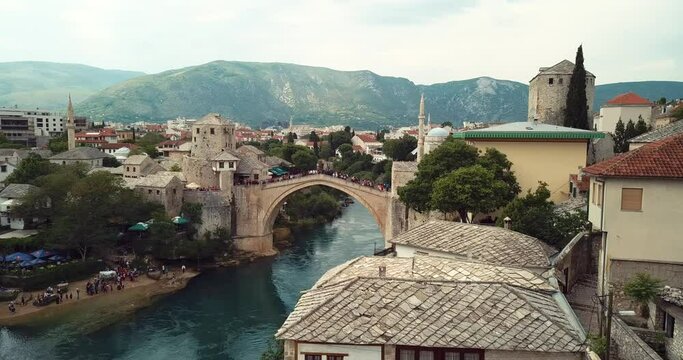 4K Footage Aerial View to the Old Bridge (Stari Most) in Mostar via the river Neretva, Bosnia and Herzegovina 