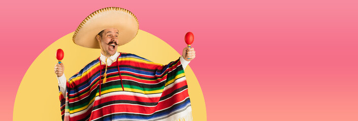 Happy man in sombrero and bright poncho isolated over red yellow background - obrazy, fototapety, plakaty
