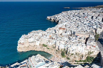 Aerial view of the sea town Polignano a Mare perched on cliffs, province of Bari, Apulia, Italy