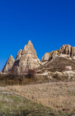 Vertical view of a field with typical rock formations and fairy chimneys in Cappadocia, Turkey