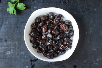 dried olive sun-dried olives dry fruit appetizer salad addition on the table healthy food meal snack copy space food background rustic top view