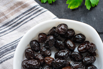 dried olive sun-dried olives dry fruit appetizer salad addition on the table healthy food meal snack copy space food background rustic top view