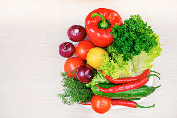 Vegetables on the kitchen table. Healthy food products on the table in the kitchen.
