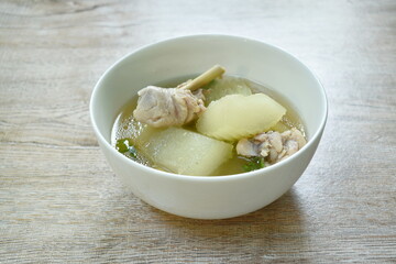 boiled winter melon with chicken leg soup on bowl