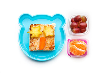 School lunch box snacks for kids over white background. Back to school. Healthy and fun snacks option for parents. Cute food art creative concepts. Bows with fruits and vegetables and cute sandwich.