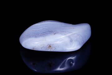 Macro mineral blue agate sapphirin in the rock on black background