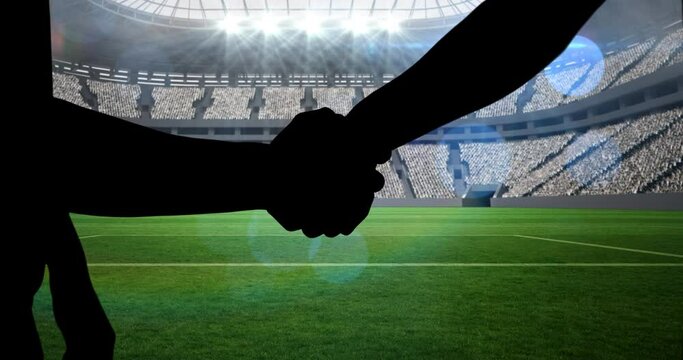 Animation of silhouettes of players shaking hands over sports stadium