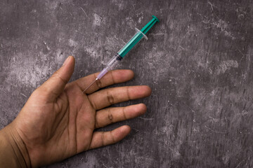 Side effects of steroid with syringe and human hand on textured background stock image.