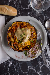 pumpkin stuffed with corn and cheese