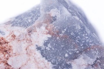 macro mineral anhydrite stone on a white background