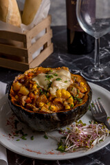 pumpkin stuffed with corn and cheese