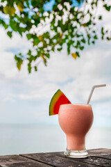 Cocktails or juice from fresh tropical fruits on the background of the sea.