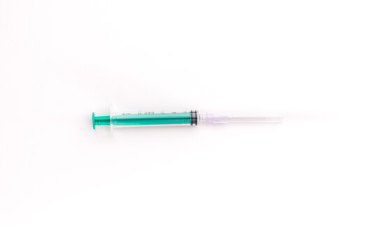 Plastic Syringe isolated stock image on texture background.
