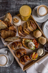 full breakfast with coffee, toast, croissants ready to eat