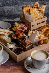 full breakfast with coffee, toast, croissants ready to eat