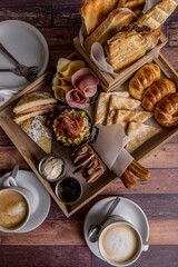 full breakfast with coffee, toast, croissants ready to eat