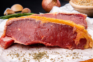 fresh raw piece of beef meat, striploin steak Marbled piece of meat Australia Grade A 
