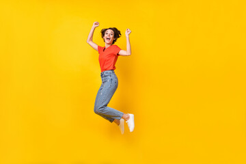 Full size profile photo of hooray nice brunette lady jump wear orange t-shirt isolated on yellow background