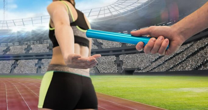 Animation of athlete's hands passing relay baton over sports stadium