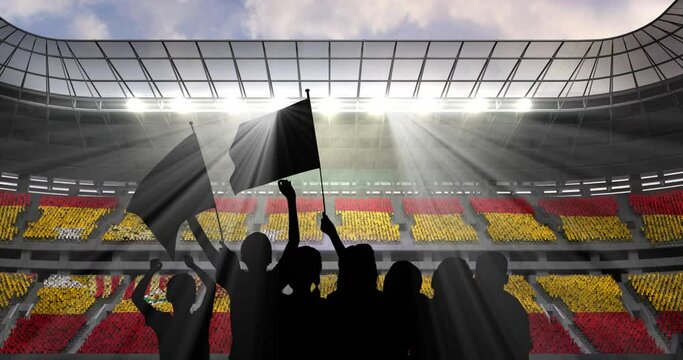 Animation of silhouettes of sports fans cheering with spanish flag over sports stadium