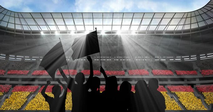 Animation of silhouettes of sports fans cheering with german flag over sports stadium