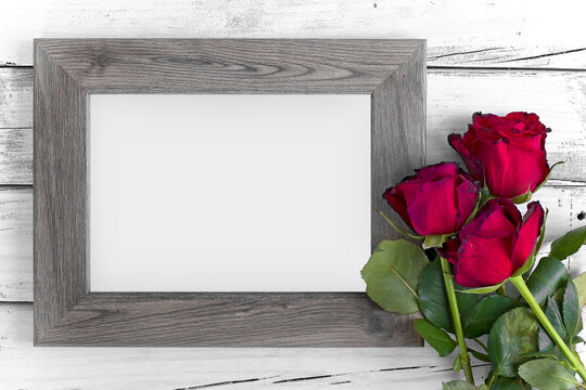 wood frame white old wood background with red roses