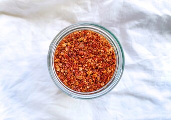 spicy red chilli pepper flakes in a bowl.