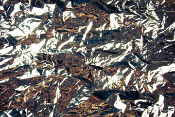 Crumpled aluminum foil texture background