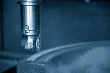 The CNC milling machine cutting the cast iron by indexable tool. The mold and die manufacturing process by machining center. © Pixel_B