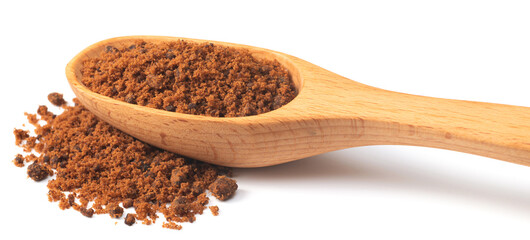 brown sugar in the wooden spoon, isolated on white background