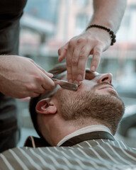 Obraz na płótnie Canvas barbershop photography. portrait of a man during hairut