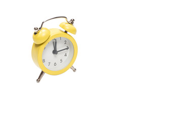 Yellow alarm clock isolated on a white.