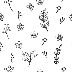 Floral and herbal ornaments seamless pattern. Hand drawn leaves and branches texture background. Nature doodles decoration.