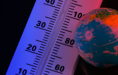 Climate control. Global warming. Weather thermometer with globe in neon light