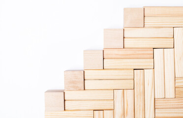 On a light background, wooden blocks and cubes with a place to insert text. Template