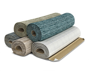 Various carpet rolls stacked one on another, isolated on white background, 3d illustration
